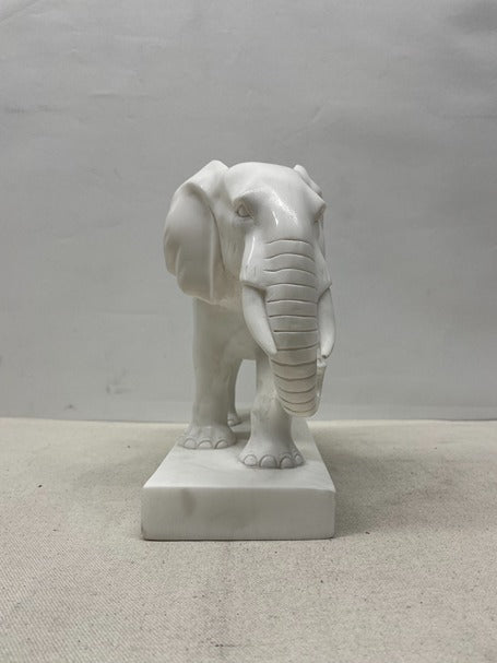 White elephant statue on a gray background
