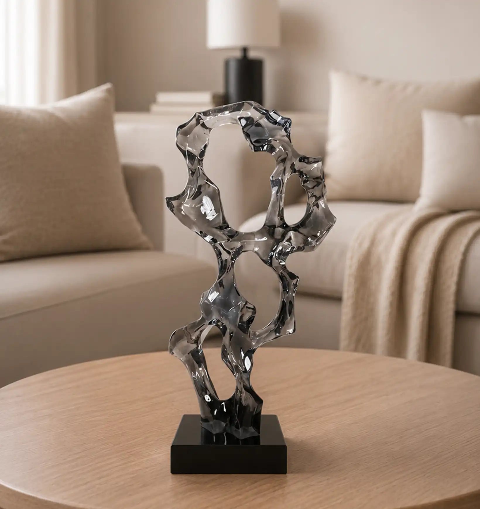 Abstract glass sculpture on a wooden table in a living room