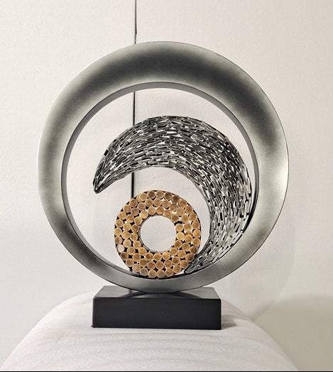 Decorative sculpture with circular design on a white background