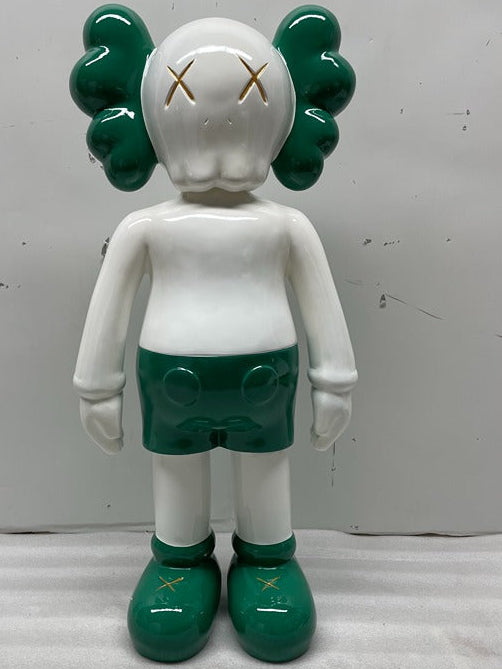 White and green character figure with a plain background