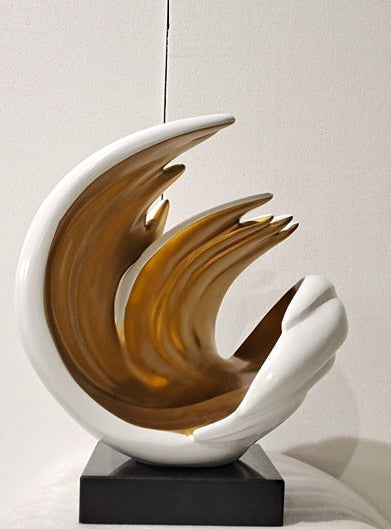 Abstract sculpture with wavy design on a white surface