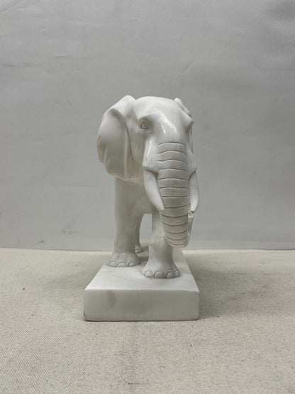 White elephant statue on a gray background